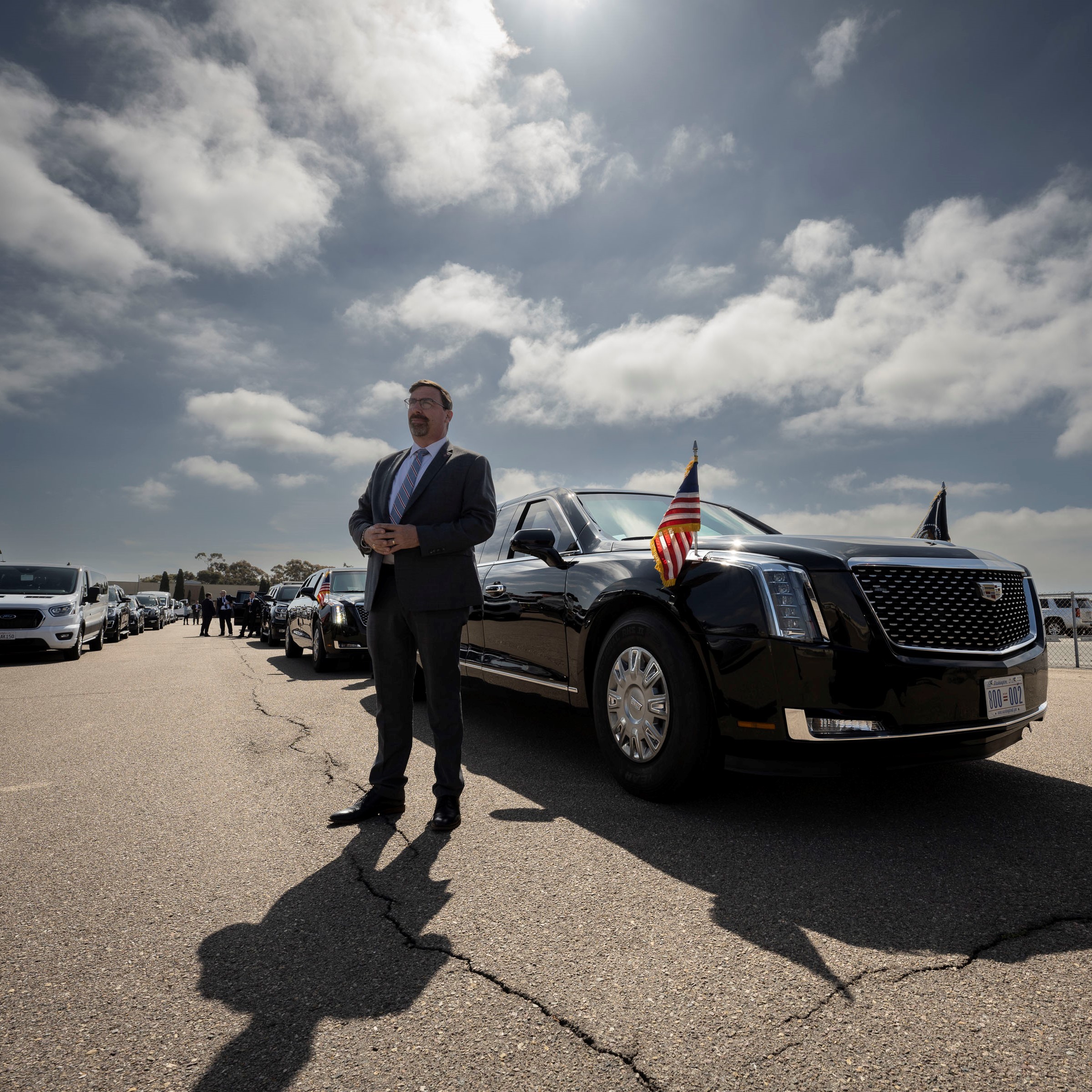 Agent standing in front of presidential vehicle